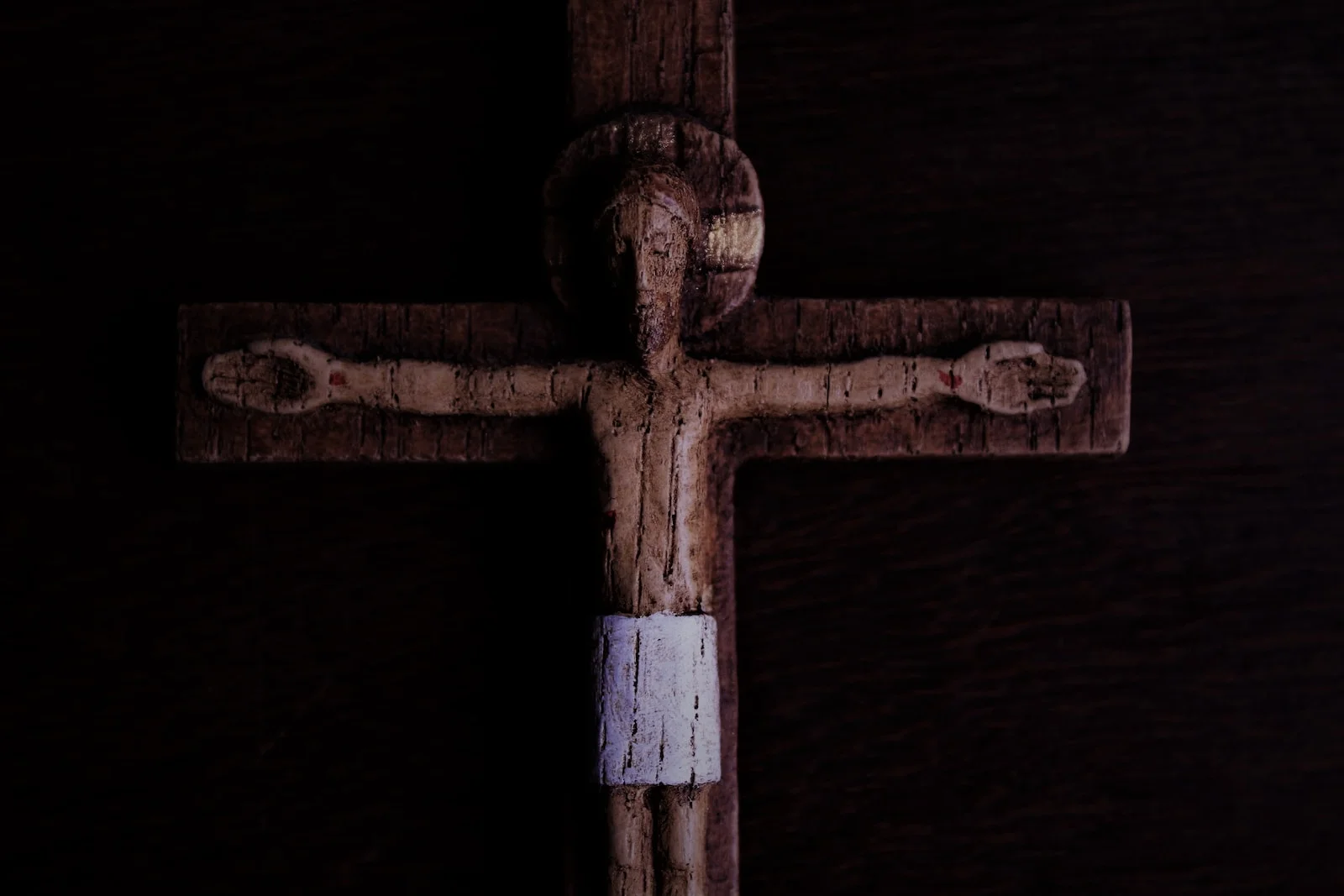 brown wooden cross with white cross