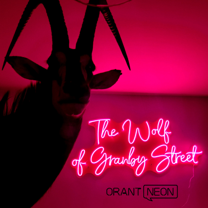 A unique gallery space is created with neon light wall art